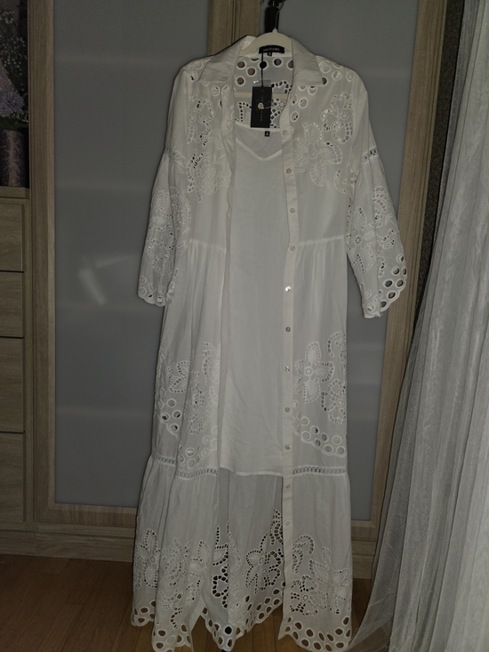 Solitaire Dresses & Skirts - Elegant white Solitaire dress, button-front, featuring perforated trim Size M
